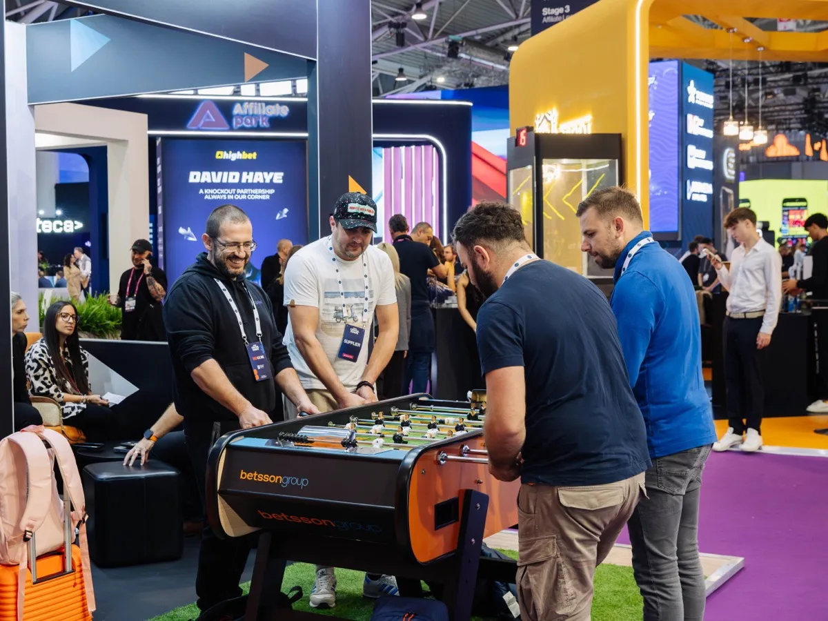 Delegates networking across the summit expo floor